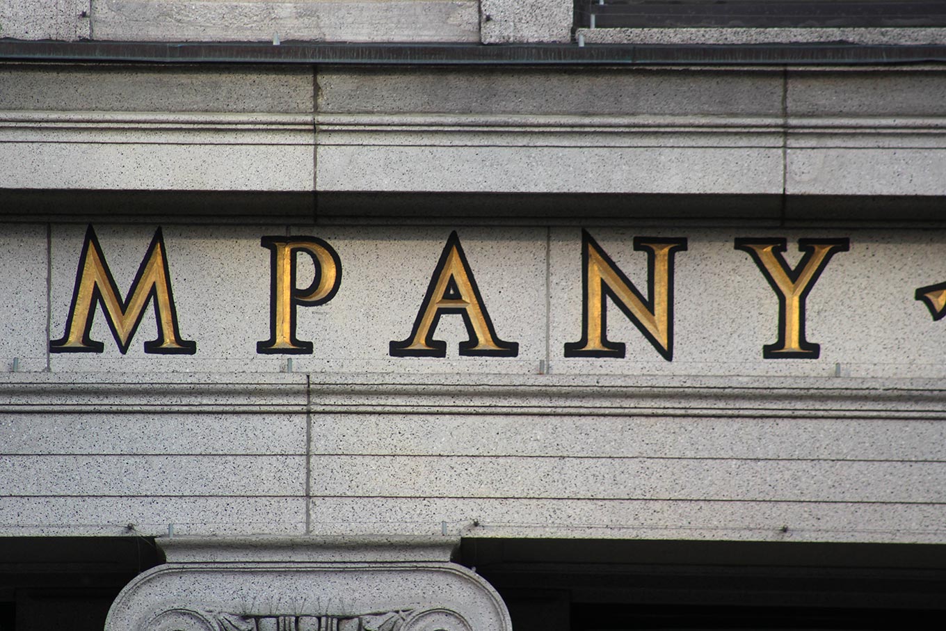 Detail of the inscribed lettering on the facade of the Canada Cement Company Building at 606, rue Cathcart