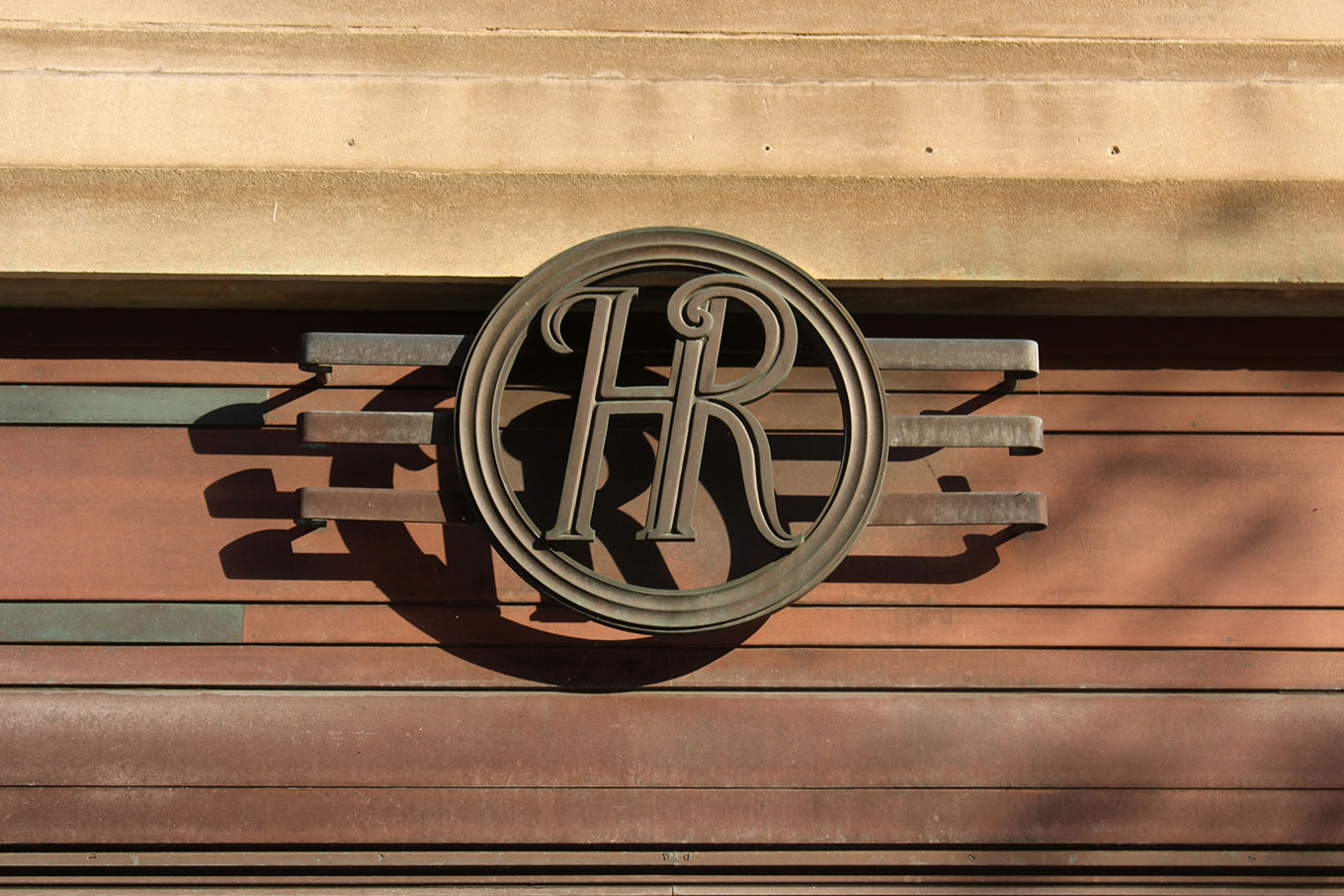 Monogram above the door of the Holt Renfrew Building on Sherbrooke Street West.