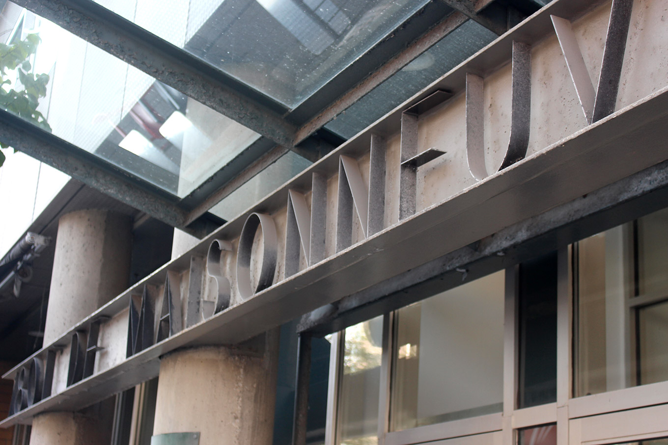 Fabricated stainless letters on the facade of a 1990s office building 1801 boulevard de Maisonneuve Ouest.